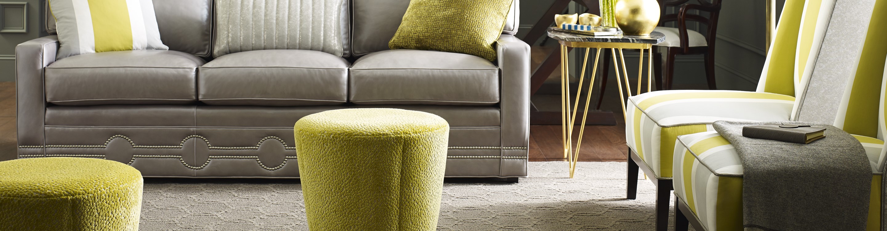 Beige area rug in a living room with lime green accents