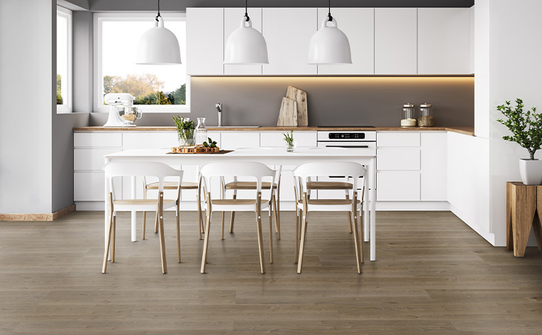 matte luxury vinyl plank flooring in white kitchen